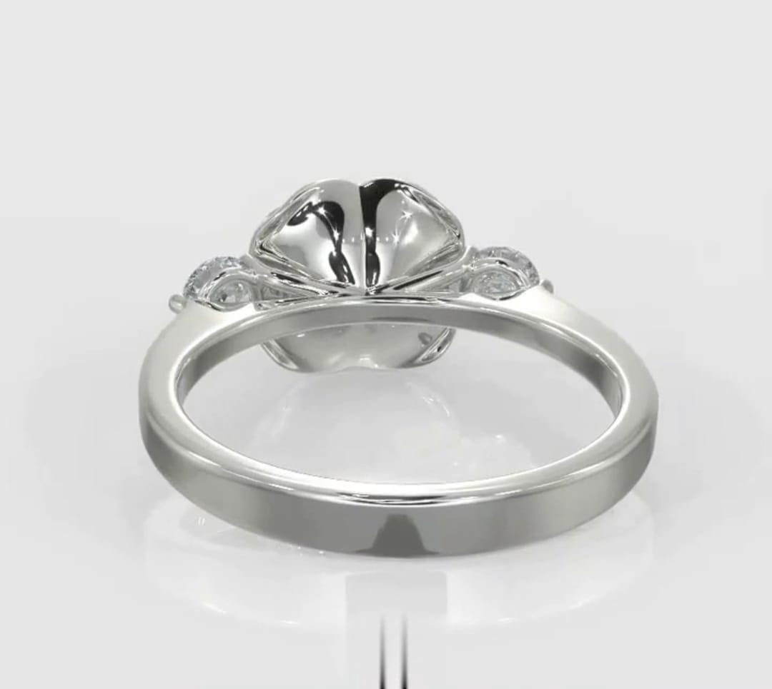 Direct bottom profile view displaying the polished band and sculpted bloom base of a rose engagement ring.