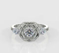 Direct top-down view of a round lab grown diamond rose engagement ring flanked by brilliant round side accents.
