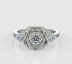 Direct top-down view of a round lab grown diamond rose engagement ring flanked by brilliant round side accents.