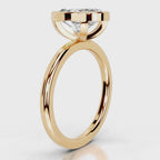 Rose gold ring with a diamond on a white background
