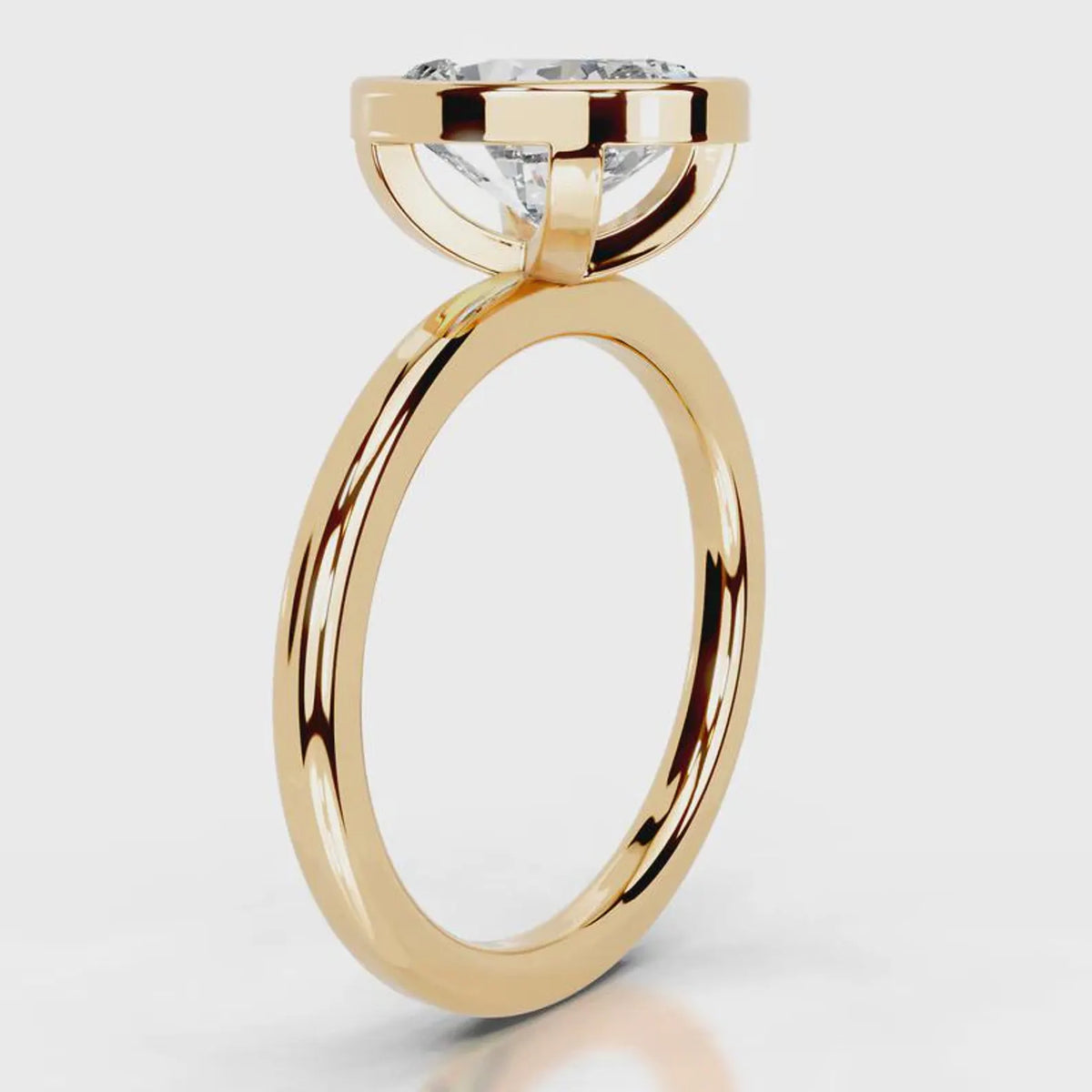 Rose gold ring with a diamond on a white background