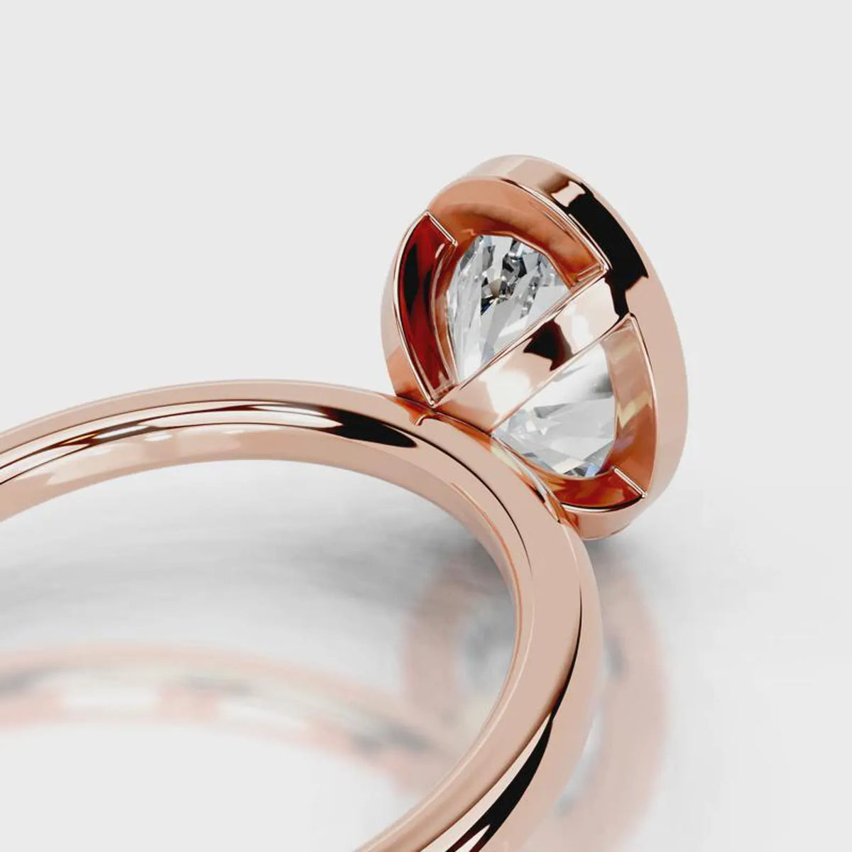 Close-up view of the open gallery basket under a 4 CT oval lab diamond in rose gold bezel setting.