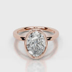 Direct top-down view of a 4 CT oval cut lab diamond in a full rose gold bezel setting.
