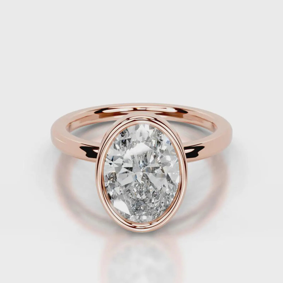 Direct top-down view of a 4 CT oval cut lab diamond in a full rose gold bezel setting.