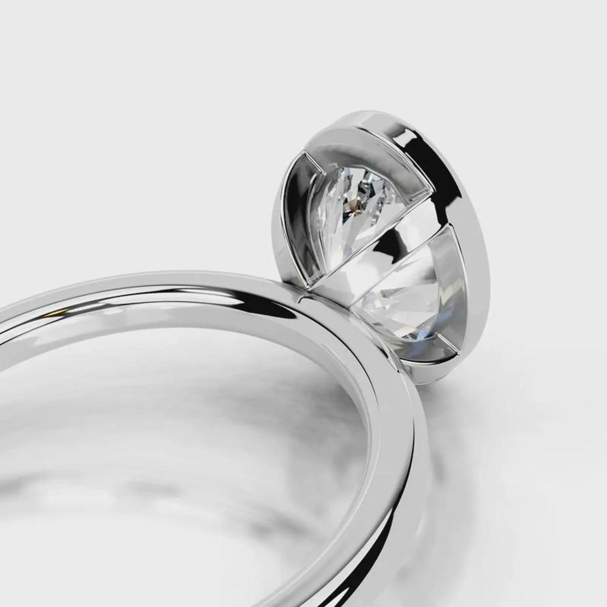 Architectural open basket detail under a 4 CT oval lab diamond bezel setting in white gold.