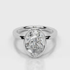 Front top-down view of a 4 CT oval lab grown diamond engagement ring in white gold bezel.