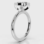 Side profile view of a 4 CT cushion cut lab grown diamond bezel ring in white gold.