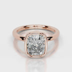 Direct front view of a 4 CT cushion cut lab diamond in a rose gold bezel setting.