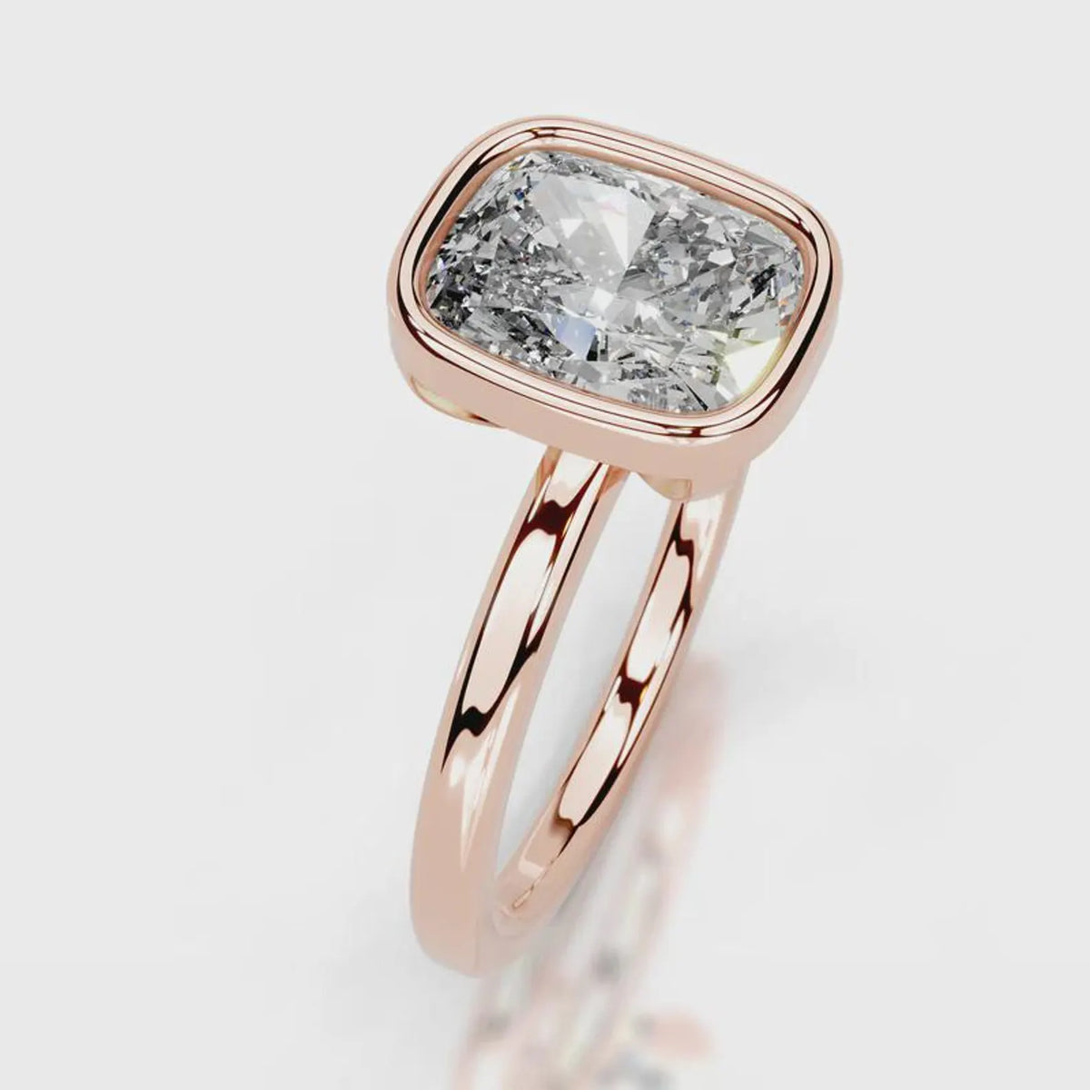 Angled perspective of a 4 CT cushion cut lab grown diamond ring in rose gold bezel setting.