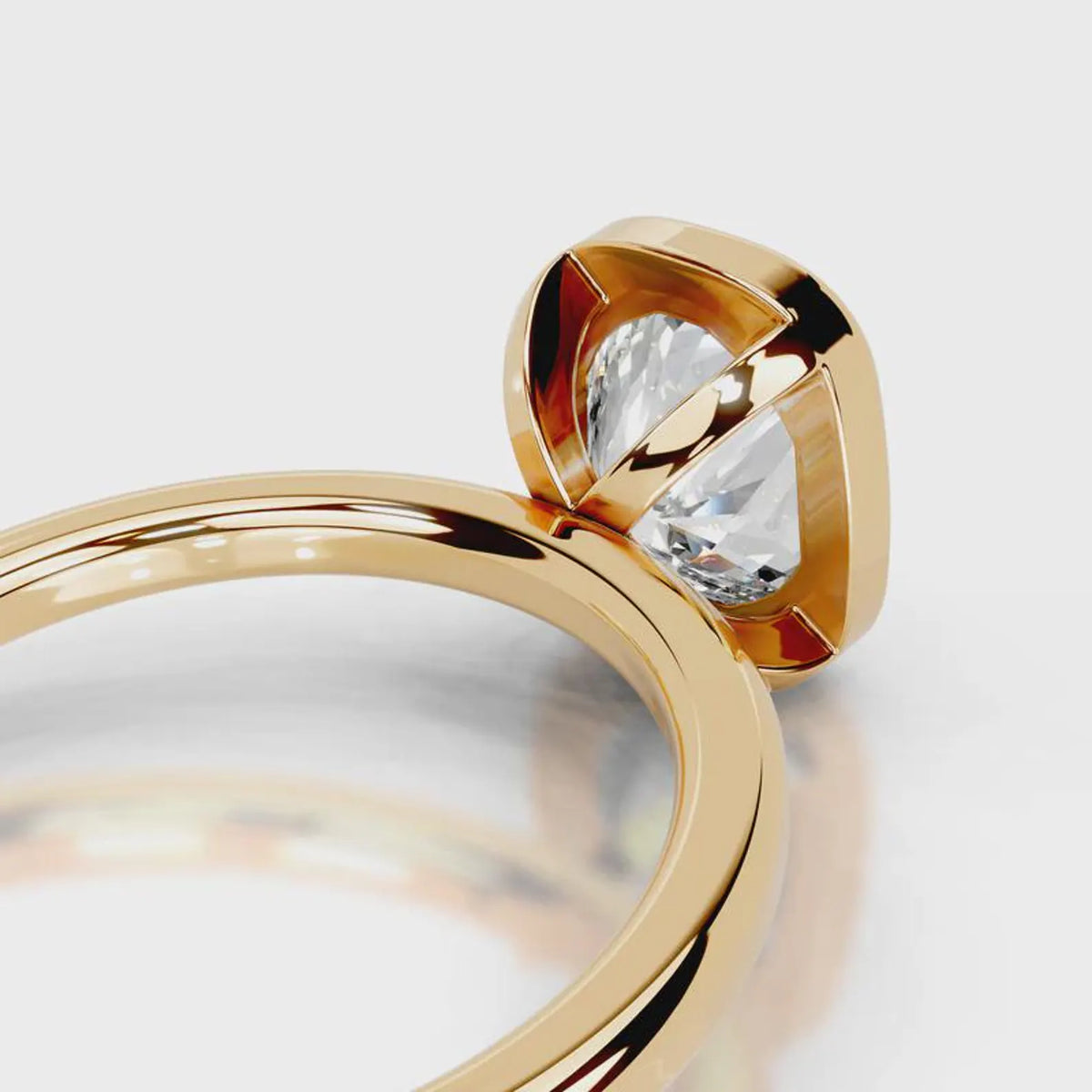 Architectural open basket detail under a 4 CT cushion lab diamond bezel in yellow gold.