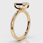 Side profile view of 4 CT radiant cut lab grown diamond bezel solitaire ring in yellow gold.