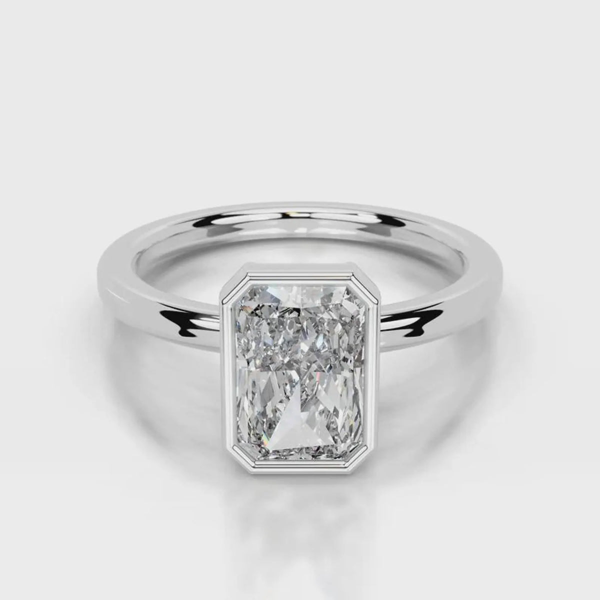 Direct top-down view of 4 CT radiant cut lab grown diamond bezel solitaire ring in white gold.