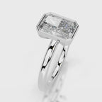 Angled perspective of 4 CT radiant cut lab diamond full bezel solitaire ring in white gold.