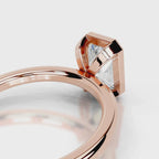 Close-up view of open gallery architectural detail on 4 CT radiant diamond ring in rose gold.