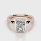 Direct top-down view of 4 CT radiant cut lab grown diamond bezel ring in rose gold.
