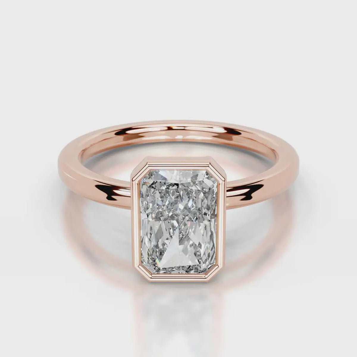 Direct top-down view of 4 CT radiant cut lab grown diamond bezel ring in rose gold.