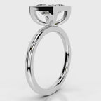 Angled top view of 4 CT princess cut lab diamond full bezel solitaire ring in white gold.