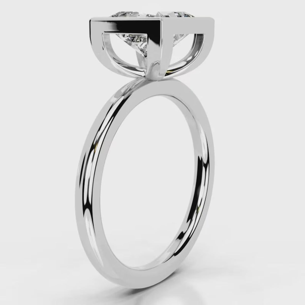 Angled top view of 4 CT princess cut lab diamond full bezel solitaire ring in white gold.