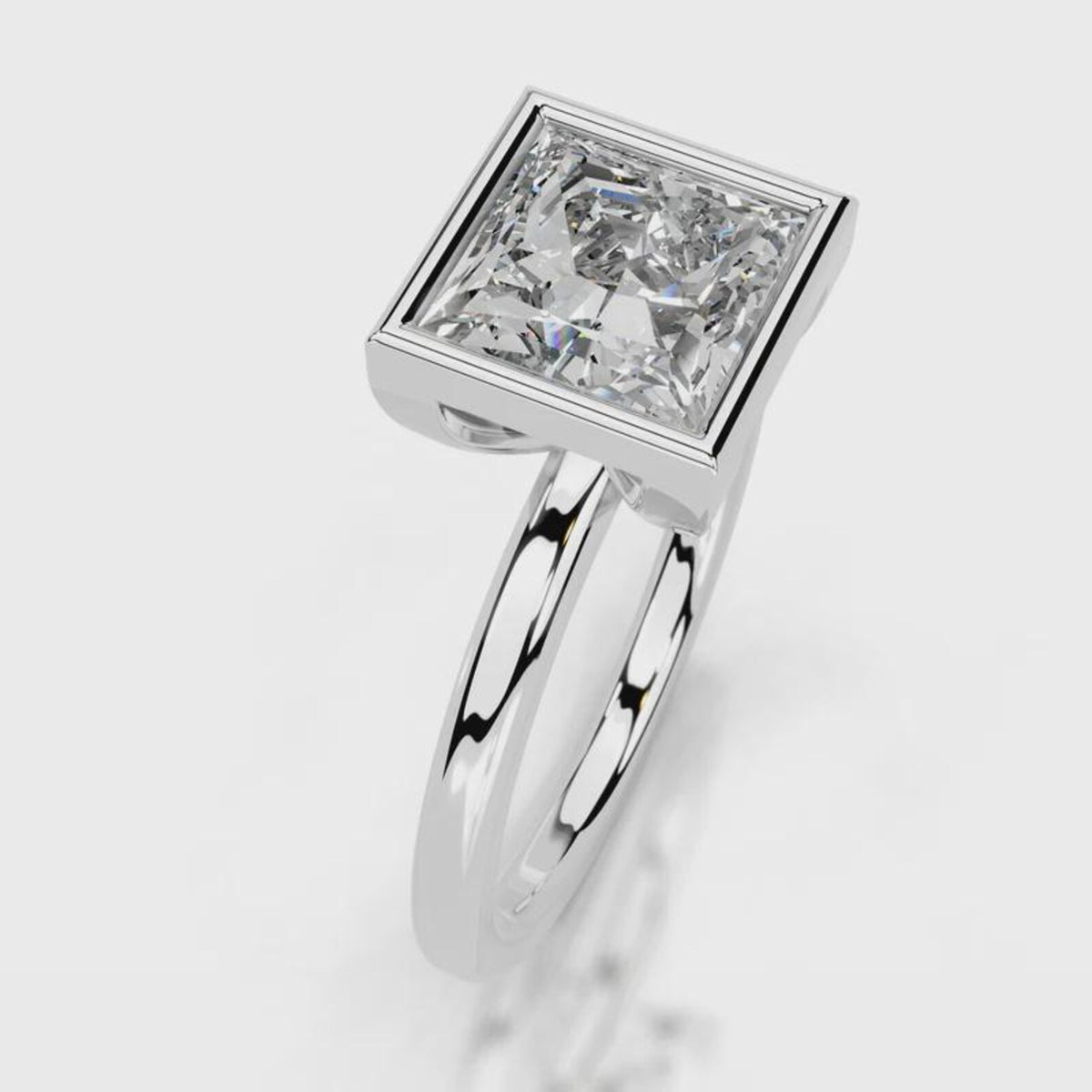 Side profile view of 4 CT princess cut lab grown diamond bezel engagement ring in white gold.