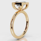 Side profile view of 4 CT princess cut lab grown diamond bezel engagement ring in yellow gold.