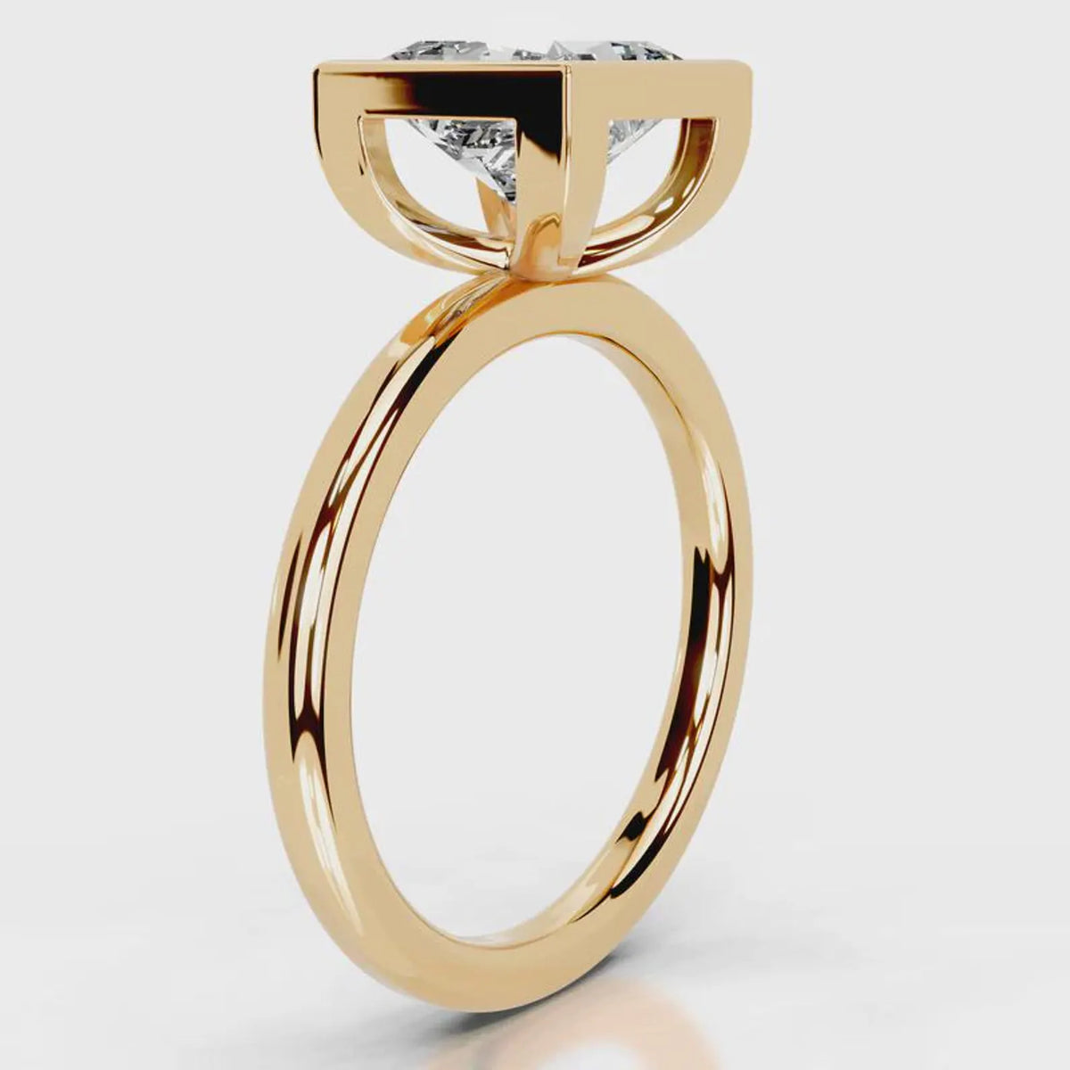 Side profile view of 4 CT princess cut lab grown diamond bezel engagement ring in yellow gold.