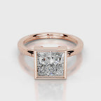 Direct front view of 4 CT princess cut lab grown diamond bezel solitaire ring in rose gold.
