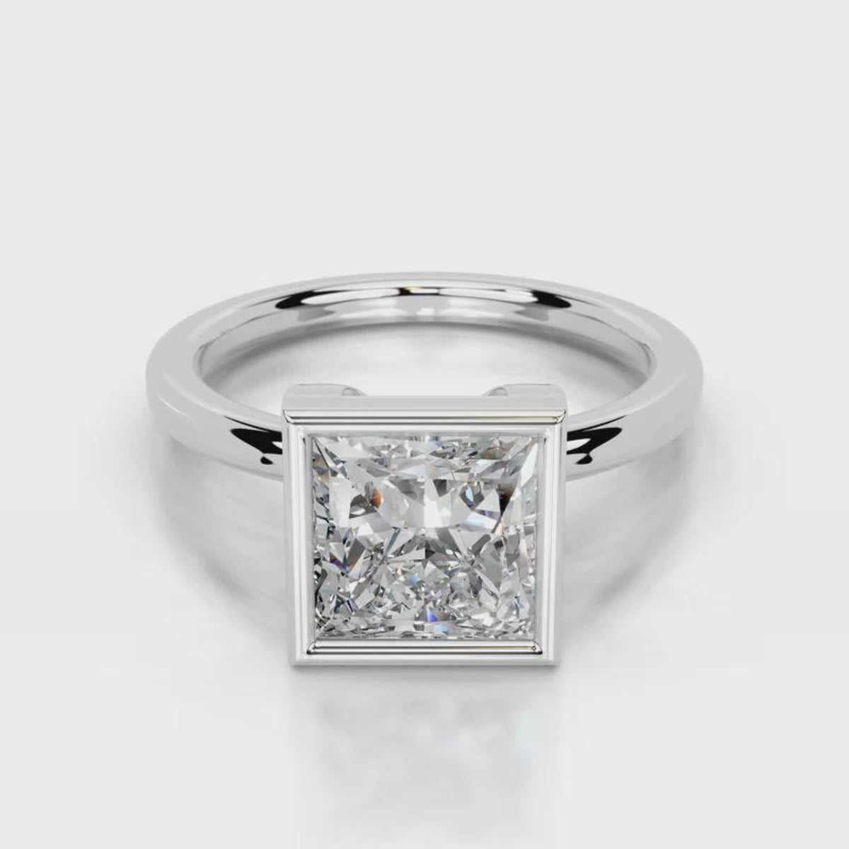 Three-quarter angle view of 4 CT princess cut lab diamond bezel engagement ring in rose gold.