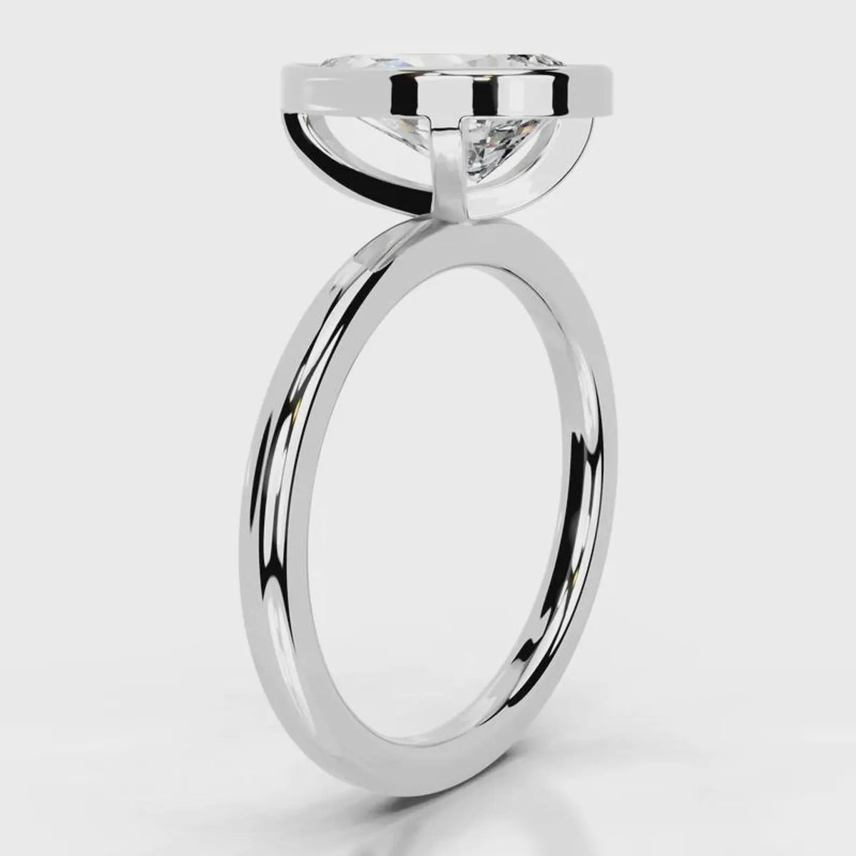 Side profile view showing architectural basket on 4 CT pear cut lab diamond ring in white gold.