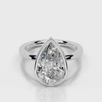 Direct top-down front view of 4 CT pear cut lab grown diamond bezel ring in white gold.