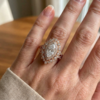 On-hand view of a 3 carat marquise lab grown diamond ring with double vintage sunburst halo in rose gold.