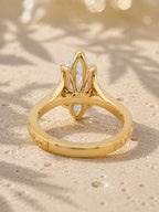 End profile showing the floral openwork tulip head structure supporting a 4 carat marquise cut lab diamond.
