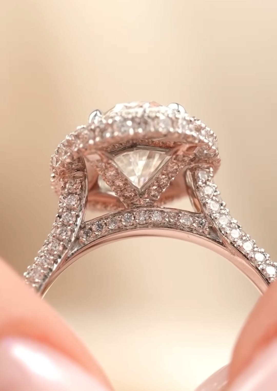 Macro close-up view highlighting the detailed hidden pavé bridge and under-gallery of a 3 carat oval halo ring.