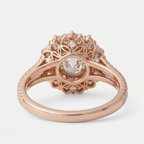 Underside view of a rose gold floral double halo lab diamond ring showing the openwork petal basket construction.