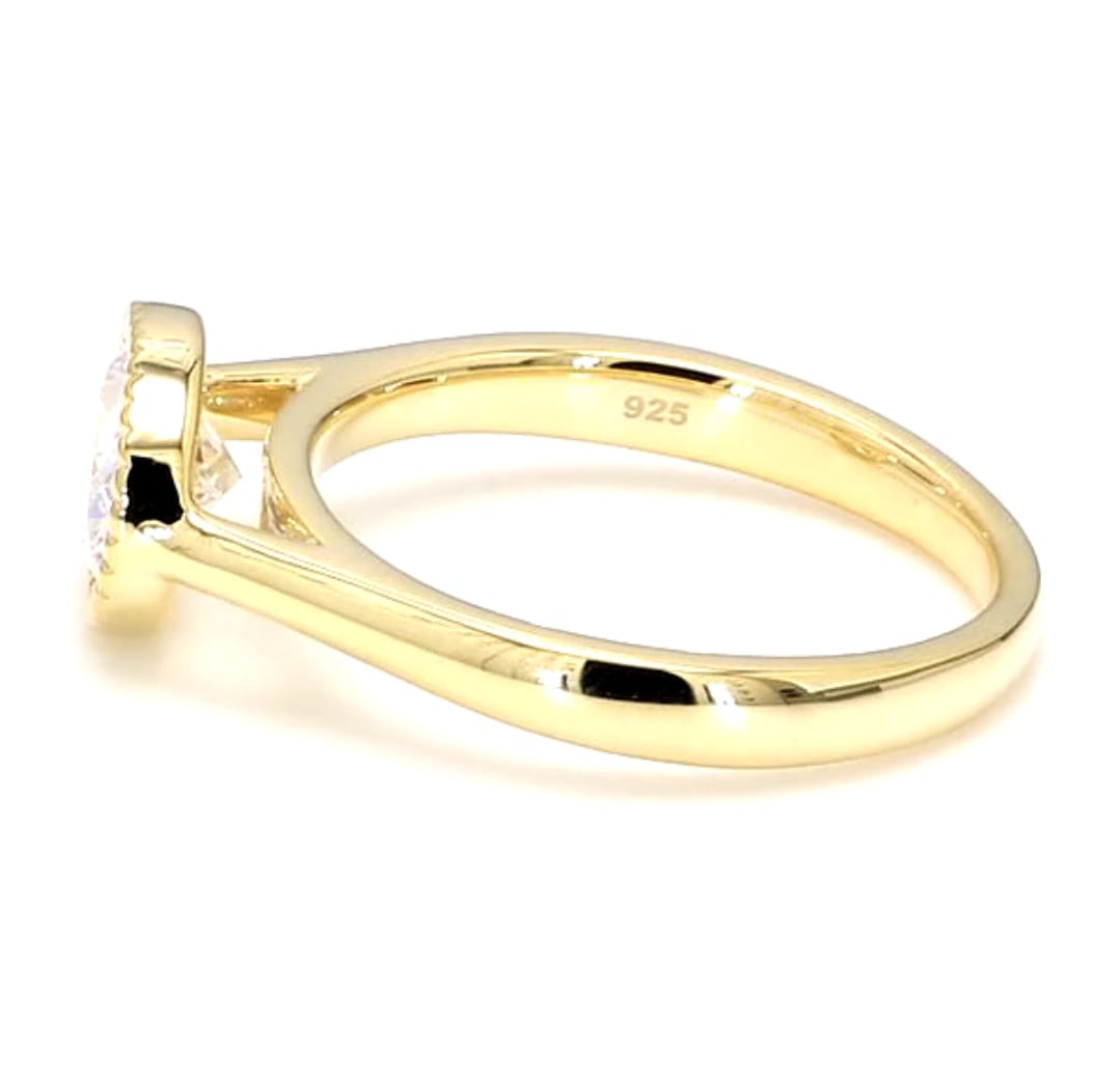 Direct side profile view of a low-profile 2 ct East-West oval lab grown diamond bezel ring.