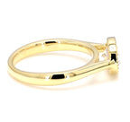 Side perspective view showing the smooth yellow gold band and bezel setting of a 2 ct oval lab diamond ring.
