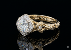 Side profile detail showing hand-carved leaf and vine scrollwork on yellow gold band.
