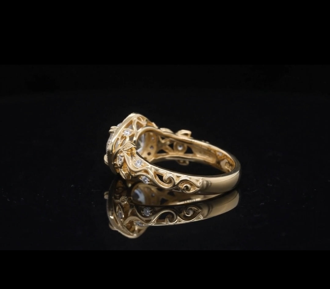 Angled side view of botanical leaf scrollwork shank on 2 CT round diamond ring.