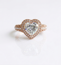 Top-down view of 4 CT heart cut diamond with milgrain halo and seed pearl band accents