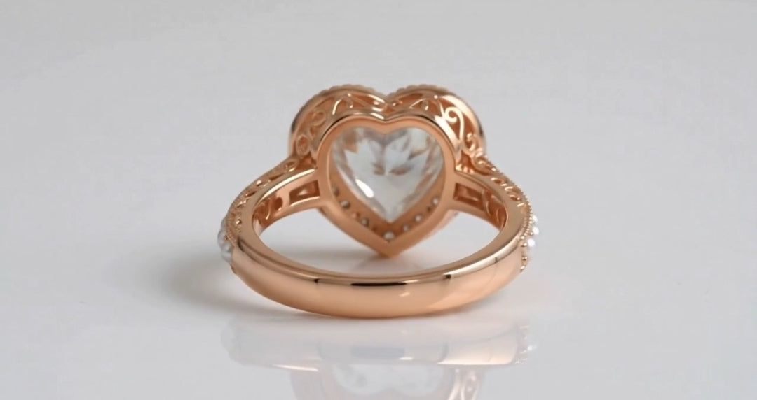 Rear view showing smooth lower shank and hollowed heart filigree under-gallery.