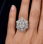 On-hand view showing scale of 3 CT oval lab diamond floral bloom ring.