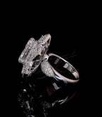 Side angle view of 3 CT oval diamond ring showing pave shoulders and elevated basket setting.