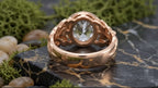 Bottom shank view of rose gold botanical ring showing smooth band and bezel under-gallery.