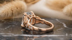 Profile view of openwork basket gallery and smooth rose gold shank on 3 CT cushion ring.