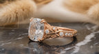 Close-up angle of rose gold vintage leaf band with bezel set accent diamonds.