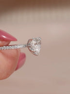 Side profile view of a 2 CT heart cut lab grown diamond engagement ring with a delicate micro-pavé band.