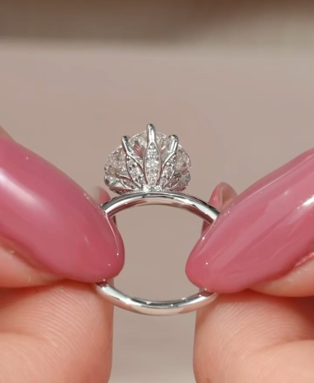 Close-up side view showing the pavé-accented lotus petal basket setting cradling a heart-cut lab diamond.