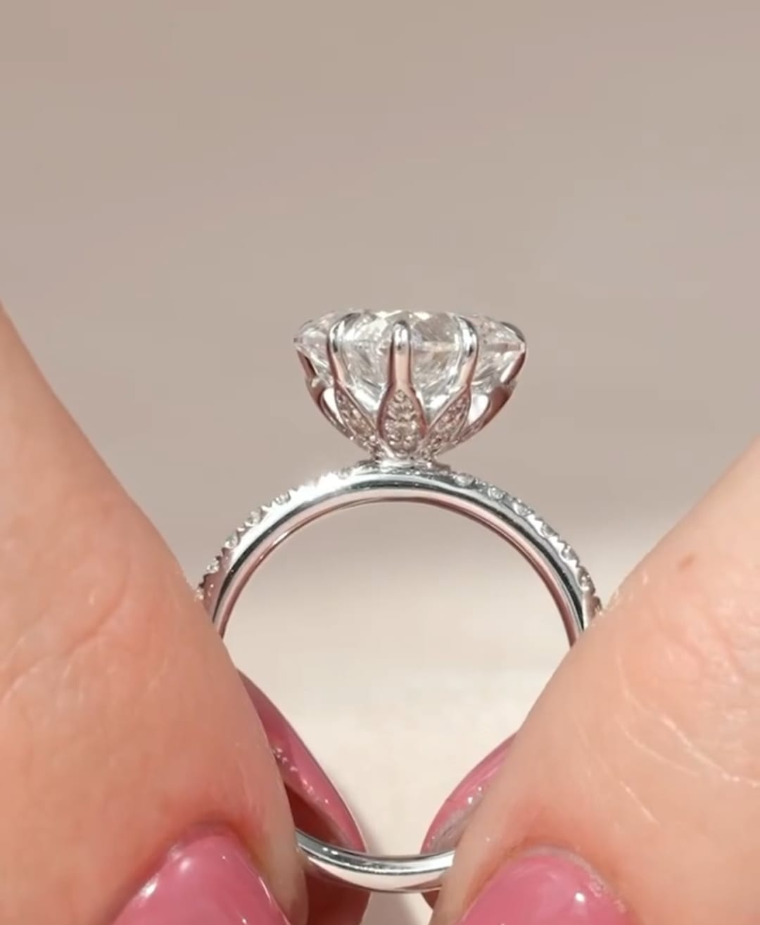 Angled profile highlighting the tulip floral basket prongs and under-gallery detail on a heart diamond ring