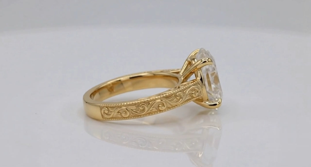 Side profile view of 4 CT oval lab diamond ring with hand-engraved scrollwork and milgrain.