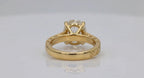 Back view showing basket gallery and smooth yellow gold inner band of 4 CT oval ring.