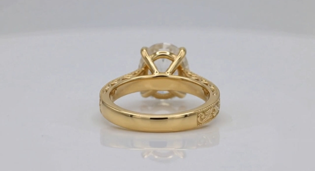 Back view showing basket gallery and smooth yellow gold inner band of 4 CT oval ring.